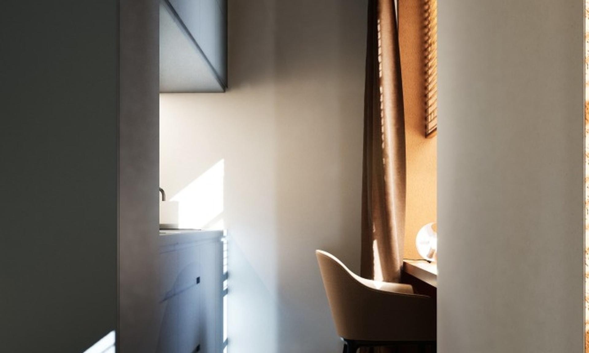 Blick zur Kochnische und zum Arbeitsplatz im Schiffli Boutique Apartment Rapperswil